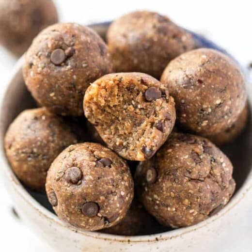 A bowl of healthy peanut butter energy balls with oats and chocolate chips