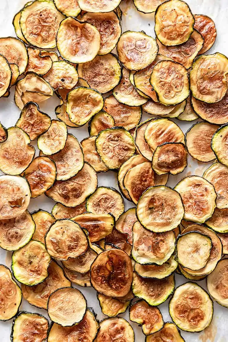 Homemade zucchini chips on parchment paper