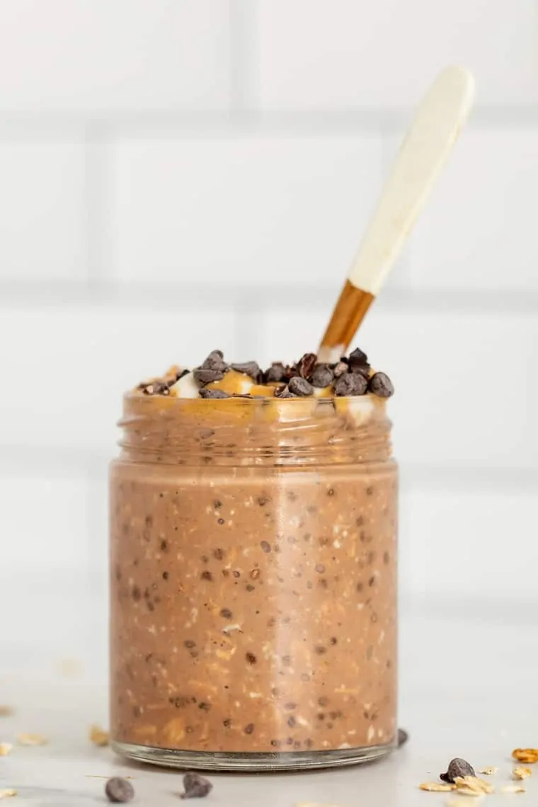 Chocolate Peanut Butter Overnight Oats in a jar with a spoon