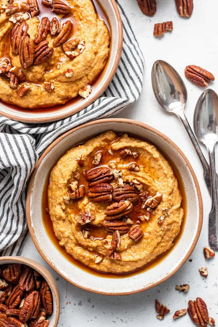 two bowls of pumpkin quinoa with pecans